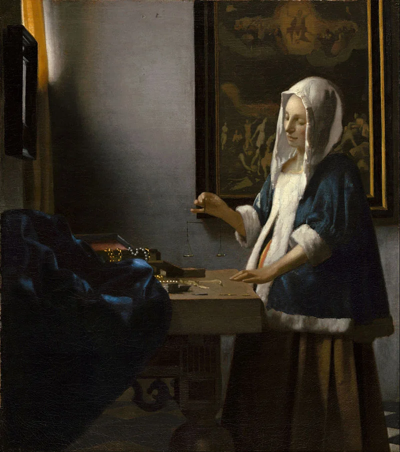 Woman Holding a Balance by Vermeer
